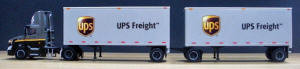#T-SP-163 	Volvo day cab and straight frame 28 ft double trailers - UPS