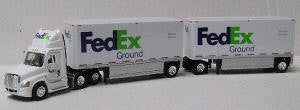 T SPT - 3127   		Freightl Cascadia Day Cab w/2 28 ft Drop Deck Trlers-- FedEx